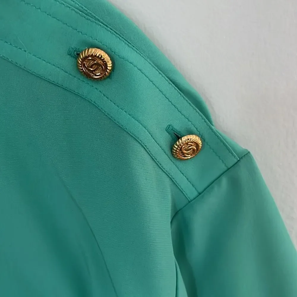 Chanel short-sleeve blouse with 4 monogrammed shoulder buttons